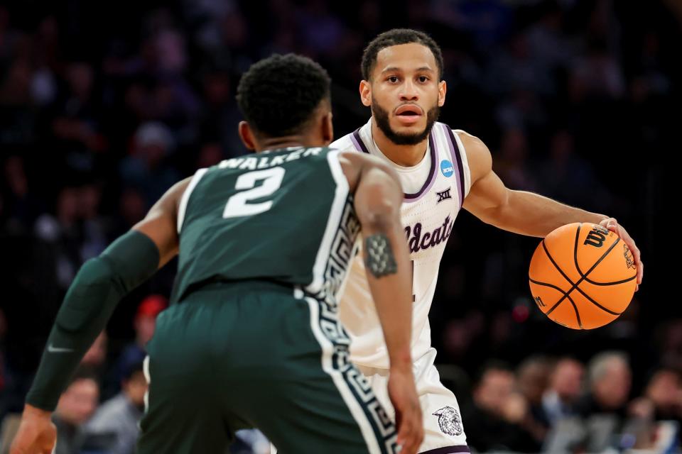 Kansas State point guard Markquis Nowell (1) works against Michigan State's Tyson Walker (2) during the first half of their NCAA Tournament game Thursday night at Madison Square Garden. Nowell had 20 points and 19 assists in the Wildcats' 98-93 overtime victory.