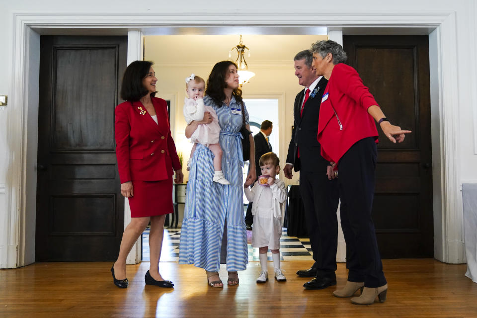 West Virginia gubernatorial candidate Mac Warner, second from right, speaks with supporters at a campaign event at the Charleston Women's Club in Charleston, W.Va., Thursday, May 4, 2023. (AP Photo/Jeff Dean)