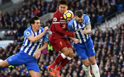 Firmino is closely marked by Brighton defenders - Credit: Reuters