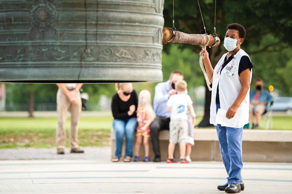 Members of the public take turns ringing the Friendship Bell during a solemn sunrise ceremony commemorating the 75th anniversary of the atomic bombing held by the Manhattan Project National Historical Park at the A.K. Bissell Park in Oak Ridge on Thursday, Aug. 6, 2020. The 78th anniversary will be marked with a similar ceremony on Sunday.