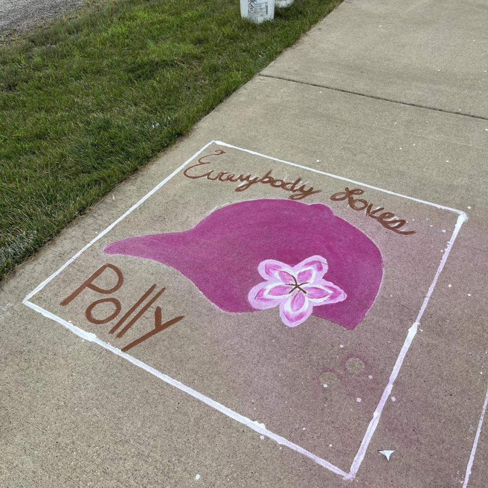 Sidewalk art celebrates popular Washington High School Spanish teacher Polly Fuller during her long battle with a malignant brain tumor.