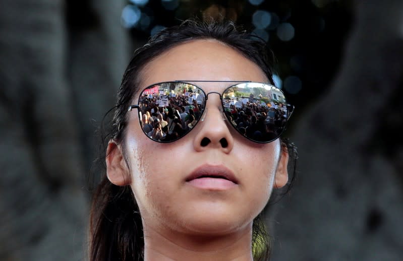 FILE PHOTO: A crowd of Deferred Action for Childhood Arrivals (DACA) program supporters is reflected in Rosario Lopez's glasses during a protest on Olivera Street in Los Angeles, California