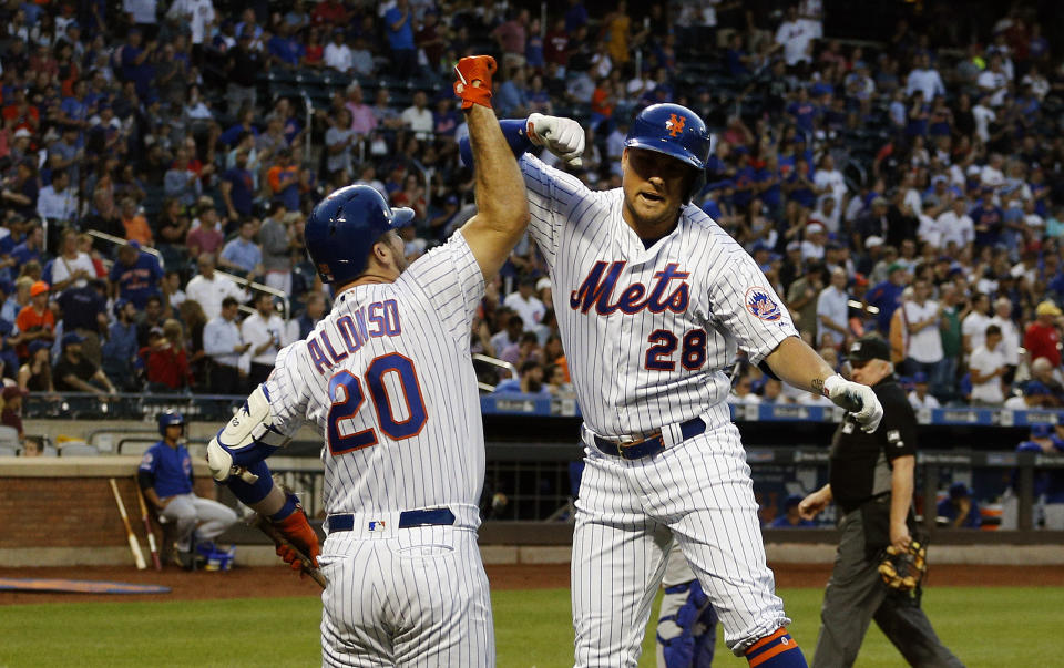 Aug 29, 2019; New York City, NY, USA; New York Mets left fielder J.D. Davis (28) is congratulated by first baseman Pete Alonso (20) after hitting a solo home run against the Chicago Cubs during the first inning at Citi Field. Mandatory Credit: Andy Marlin-USA TODAY Sports