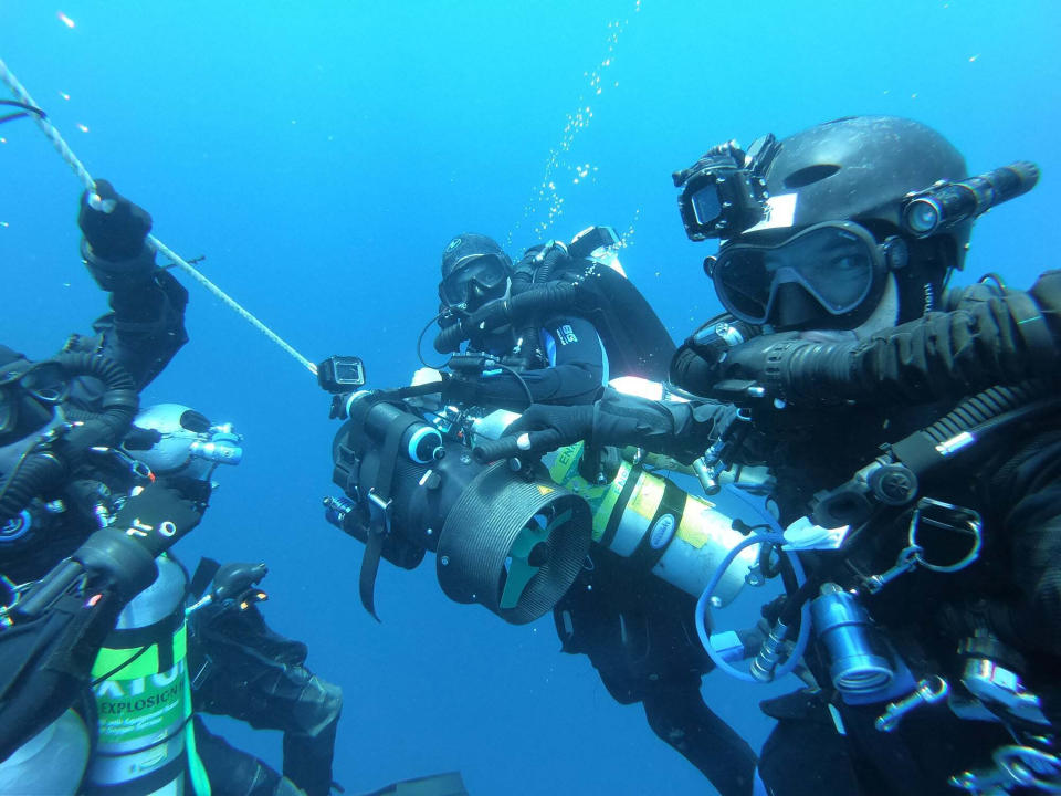 Belgian diver Ben Reymenants, right, poses for an underwater selfie photo along with Australian diver Lance Horowitz in the Strait of Malacca on Nov. 6, 2019. Divers including Reymenants have found what they believe is the wreck of a U.S. Navy submarine lost 77 years ago in Southeast Asia, providing a coda to a stirring but little-known tale from World War II. (Ben Reymenants via AP)