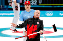 Curling - Pyeongchang 2018 Winter Olympics - Men's Semi-final - Canada v U.S. - Gangneung Curling Center - Gangneung, South Korea - February 22, 2018 - Skip Kevin Koe of Canada reacts as second Matt Hamilton of the U.S. looks on. REUTERS/Cathal McNaughton