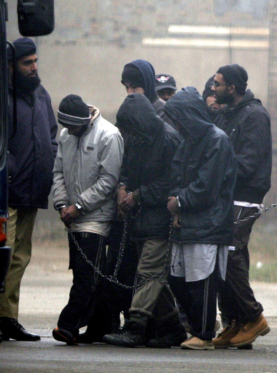 FILE - Detained American Muslims leave after appearing in an anti terrorist court in Sargodha, Pakistan, Monday, Jan. 18, 2010. Five Americans from northern Virginia who served a decade in Pakistani prison are now facing similar charges in the U.S. (AP Photo/Anjum Naveed, File)
