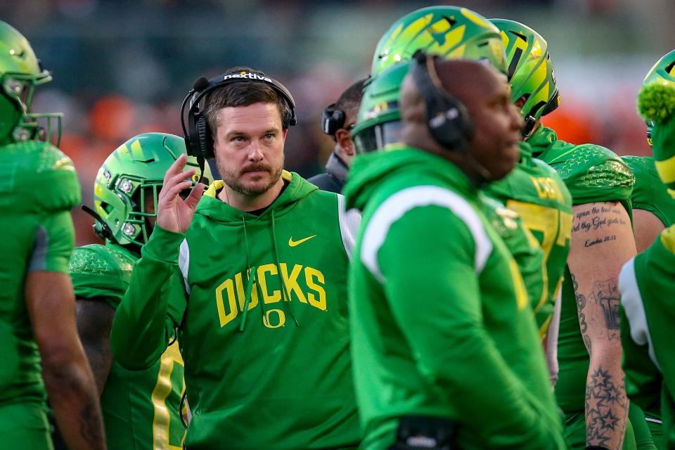 Oregon head coach Dan Lanning looks toward the scoreboard during a timeout in the second half as the No. 9 Oregon Ducks take on the No. 21 Oregon State Beavers at Reser Stadium in Corvallis on Nov. 26.