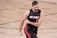 Miami Heat guard Goran Dragic (7) celebrate scoring against the Boston Celtics during the second half of Game 4 of an NBA basketball Eastern Conference final, Wednesday, Sept. 23, 2020, in Lake Buena Vista, Fla. (AP Photo/Mark J. Terrill)