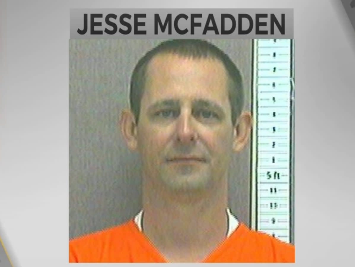 A police or prison mugshot shows Jesse McFadden, a white man apparently in middle age, with receding close-cropped dark hair and deep lines on his cheeks, wearing an orange jumpsuit and looking neutrally at the camera (KOTV-DT)