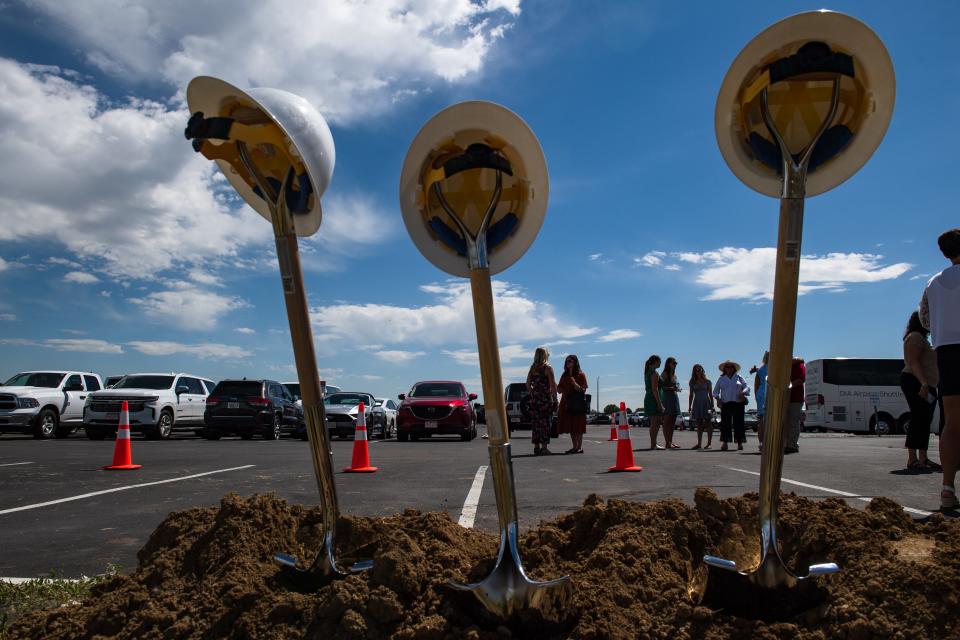 People mingle after a groundbreaking ceremony for a new terminal at the Northern Colorado Regional Airport on Thursday, July 13, 2023, in Loveland, Colo.