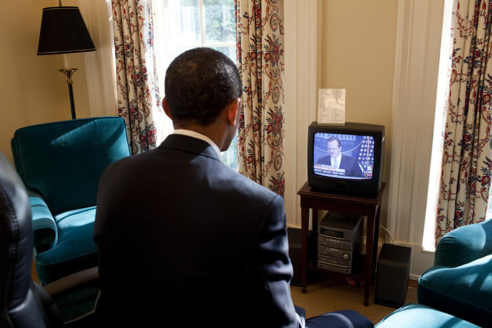 Obama watches Press Secretary Robert Gibbs' first press briefing on television, in his private study off the Oval Office on Jan. 22, 2009.