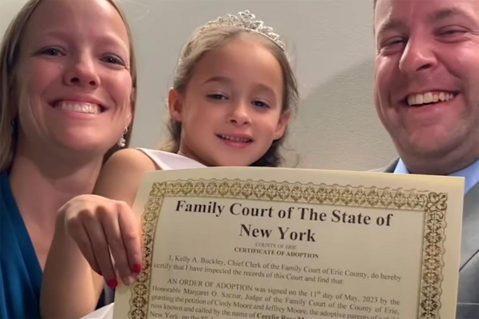 Cindy and Jeffrey Moore pose with their daughter Cece