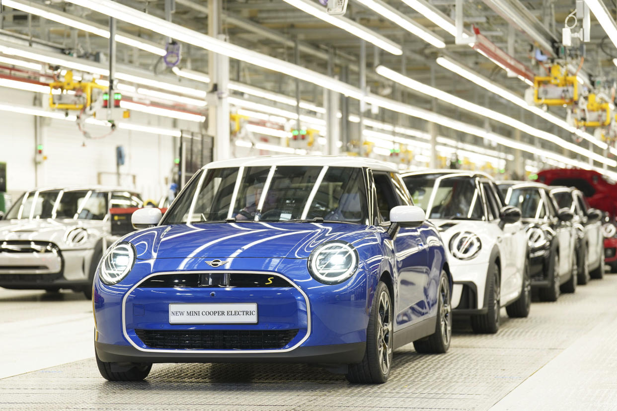 policy incentives MINI cars stand in a row at the MINI plant at Cowley in Oxford, England, Monday, Sept. 11, 2023. German automaker BMW is set to announce plans to build the next generation electric Mini in Britain after securing U.K. government support for a multimillion-pound investment in the company’s Oxford factory. The government on Monday confirmed its backing for the project, which will protect 4,000 jobs. (Joe Giddens/PA via AP)