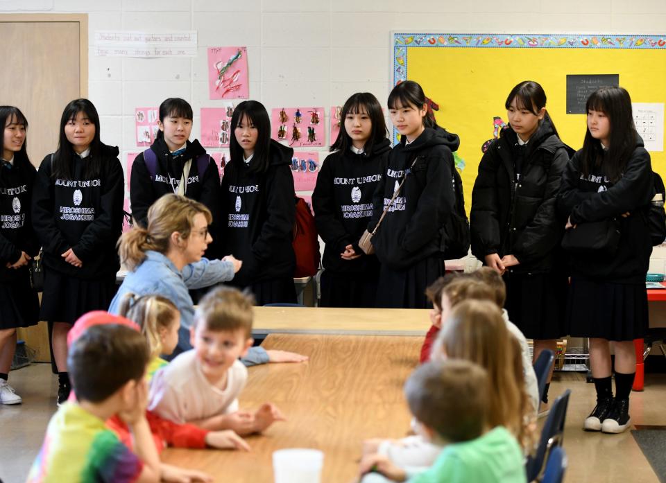 Japanese students hosted by the University of Mount Union and staying with host families introduces themselves  Wednesday, March 29, 2023, while visiting Union Avenue United Methodist Church's preschool class.