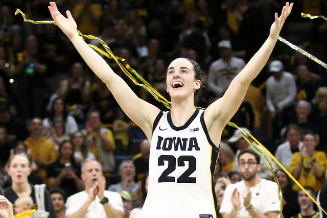 <p>Matthew Holst/Getty</p> Caitlin Clark celebrates a win after a March 2024 game