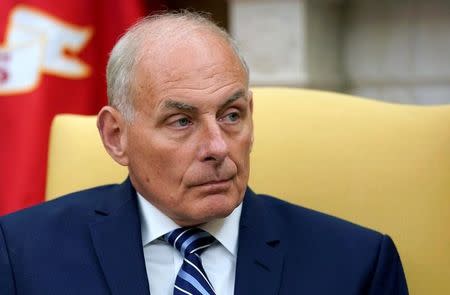 FILE PHOTO - John Kelly sits after he was sworn in as White House Chief of Staff in the Oval Office of the White House in Washington, U.S. on July 31, 2017. REUTERS/Joshua Roberts/File Photo