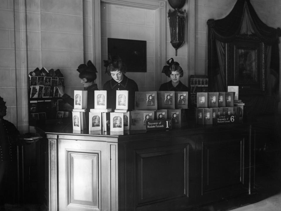 circa 1930: Sales assistants in the souvenir bookshop at Madame Tussaud's, London.