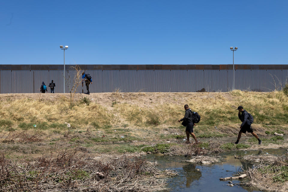 Venezuelan migrants approach the U.S. Border Patrol by foot to cross the border and apply for humanitarian asylum in the United States on April 10, 2023, in Ciudad Juarez, Mexico. / Credit: David Peinado/Anadolu Agency via Getty Images