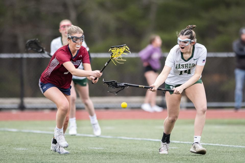 Westborough's Kate Sams and Nashoba's Sofia Fiore reach for the ball.