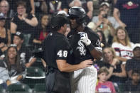 Chicago White Sox's Tim Anderson, right, points at home plate umpire Nick Mahrley after Anderson made contact with Mahrley during the seventh inning of the team's baseball game against the Oakland Athletics on Friday, July 29, 2022, in Chicago. Anderson was ejected. (AP Photo/Charles Rex Arbogast)