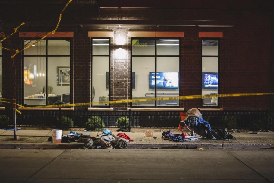 <div class="inline-image__caption"><p>Debris litters the street after the carnage in Waukesha.</p></div> <div class="inline-image__credit">Getty</div>