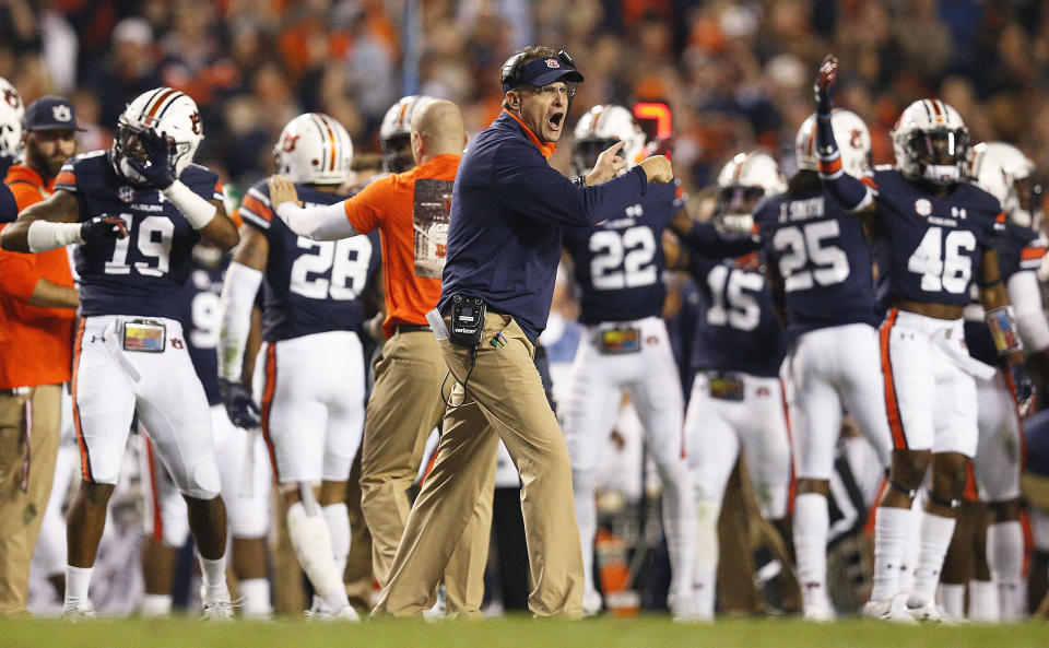 Auburn head coach Gus Malzahn reacts as his players celebrate their win against Alabama during the second half of the Iron Bowl NCAA college football game, Saturday, Nov. 25, 2017, in Auburn, Ala. Auburn won 26-14. (AP)