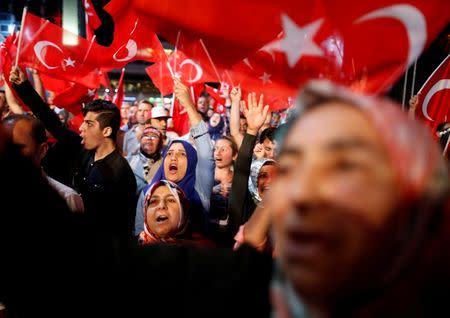 Supporters of Turkish President Tayyip Erdogan wave Turkish flags during a pro-government demonstration at Taksim square in central Istanbul, Turkey, July 20, 2016.REUTERS/Ammar Awad