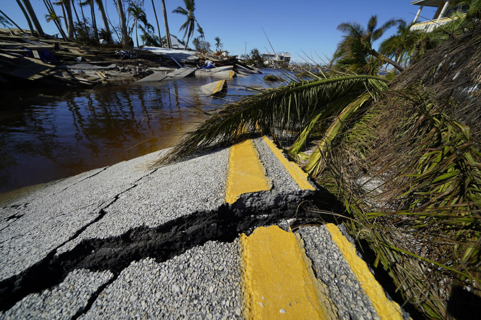 CORRECTS DATELINE TO MATLACHA, FLA., INSTEAD OF SPRING HILL - The destroyed bridge leading to Pine Island is seen in the aftermath of Hurricane Ian in Matlacha, Fla., Sunday, Oct. 2, 2022. The only bridge to the island is heavily damaged so it can only be reached by boat or air. (AP Photo/Gerald Herbert)