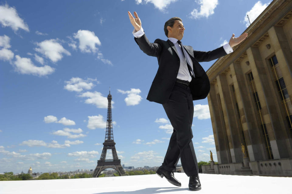 FILE - In this Tuesday May 1, 2012 file picture, French President and conservative candidate for his re-election in the 2012 French presidential elections, Nicolas Sarkozy reacts to supporters as he arrives on stage at Trocadero square to deliver a speech during a campaign rally in front the Eiffel Tower in Paris. The trial of former French President Nicolas Sarkozy concludes Tuesday in Paris, after a month during which the court sought to determine whether he broke laws on campaign financing in his unsuccessful 2012 re-election bid. (AP Photo/Philippe Wojazer, Pool, File)