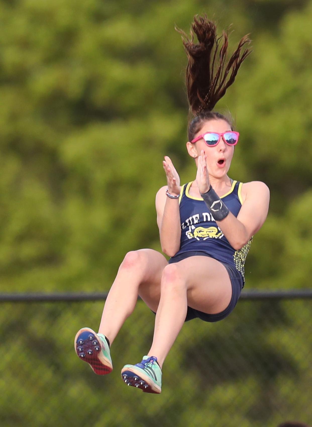 Tallmadge pole vaulter Kate Archer reacts after clearing the bar during the Suburban League American Conference track championships at Tallmadge High School on Wednesday, May 8, 2024.