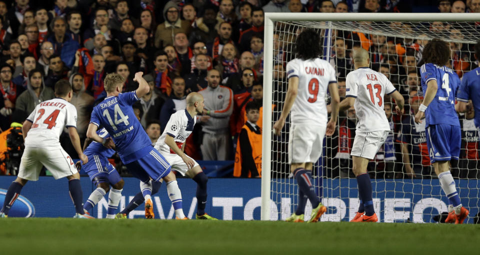 Chelsea's Andre Schuerrle, second left, scores his side's first goal during the Champions League second leg quarterfinal soccer match between Chelsea and Paris Saint-Germain at Stamford Bridge Stadium in London, Tuesday, April 8, 2014. (AP Photo/Kirsty Wigglesworth)