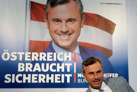 Austrian presidential candidate Norbert Hofer of the Freedom Party (FPOe) arrives for a news conference ahead of a re-run of the run-off presidential election in Vienna, Austria August 29, 2016. Poster reads "Austria needs safety". REUTERS/Heinz-Peter Bader
