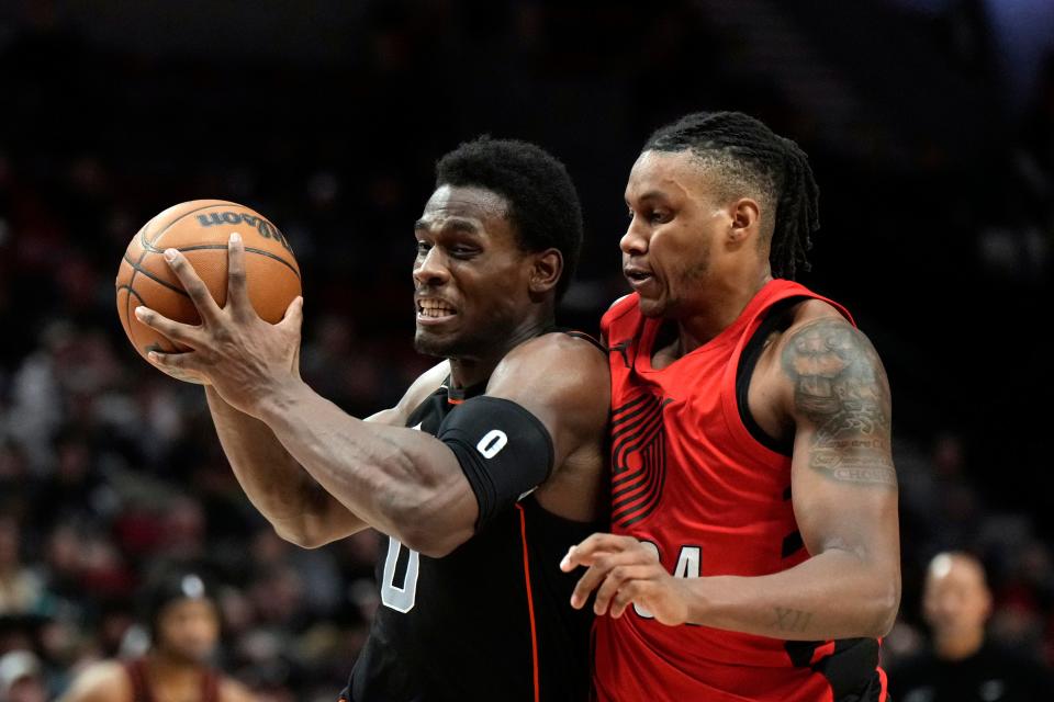 Detroit Pistons center Jalen Duren (0) drives to the basket against Portland Trail Blazers forward Jabari Walker (34, right) during the first half at Moda Center in Portland, Oregon, on Thursday, Feb. 8, 2024.