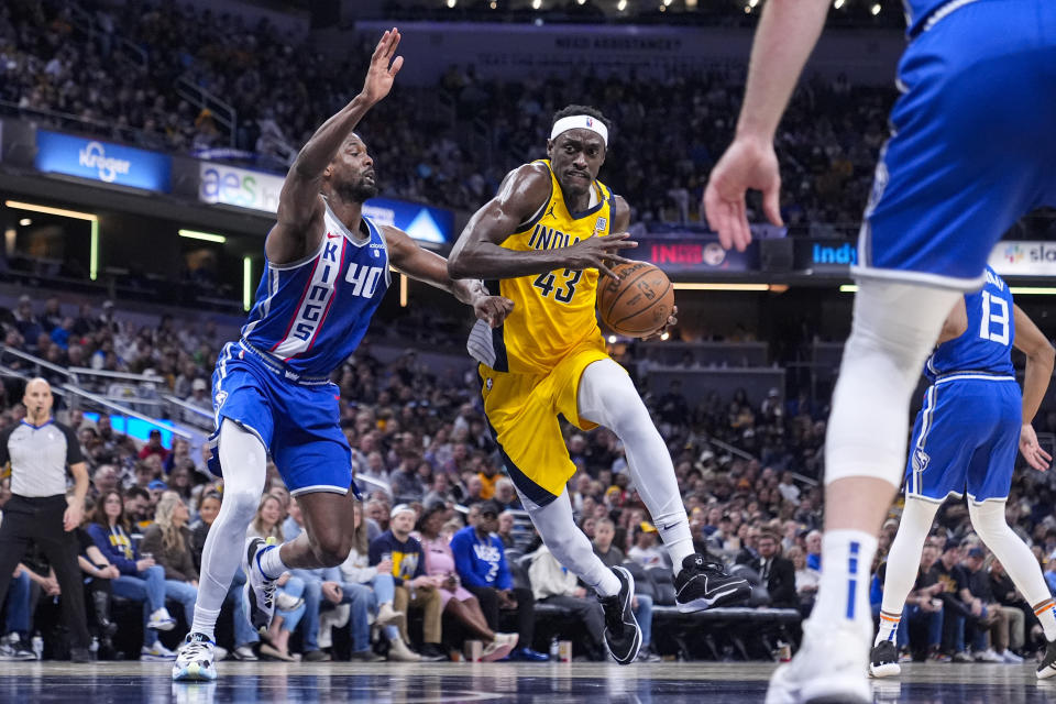 Indiana Pacers forward Pascal Siakam (43) drives on Sacramento Kings forward Harrison Barnes (40) during the second half of an NBA basketball game in Indianapolis, Friday, Feb. 2, 2024. (AP Photo/Michael Conroy)