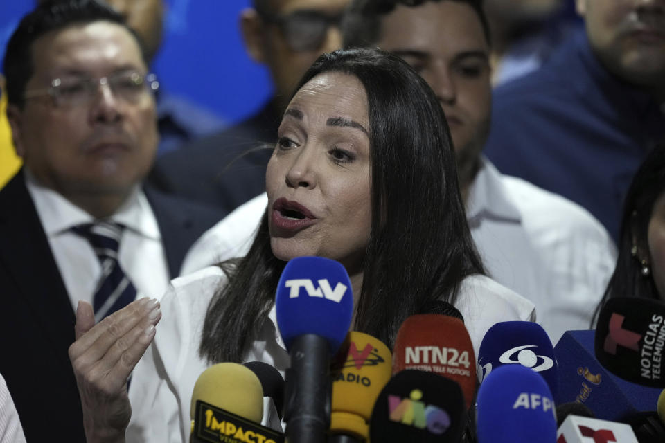 Opposition leader María Corina Machado speaks during a press conference regarding the arrest order for her campaign manager and eight other opposition members for alleged involvement in a conspiracy plot to destabilize the government, in Caracas, Venezuela, Wednesday, March 20, 2024. Machado has been disqualified from holding public office for 15 years but has continued to campaign for president ahead of the July 28 elections. (AP Photo/Ariana Cubillos)