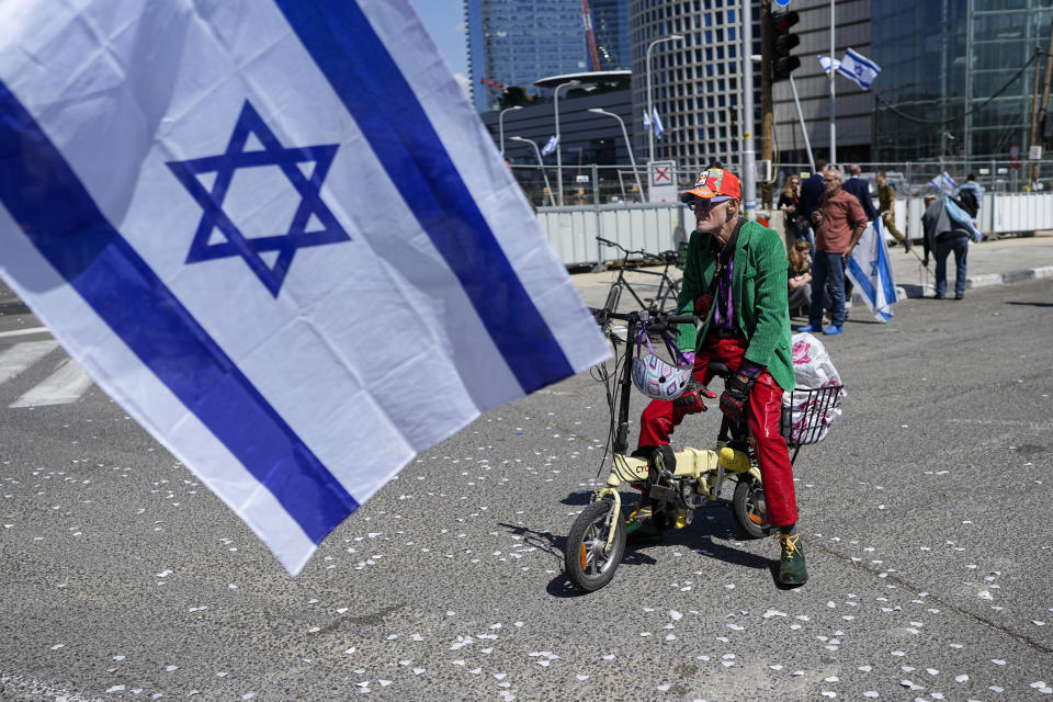 Israelis protest against plans by Prime Minister Benjamin Netanyahu's new government to overhaul the judicial system, in Tel Aviv, Israel, Thursday, March 16, 2023. (AP Photo/Ohad Zwigenberg)