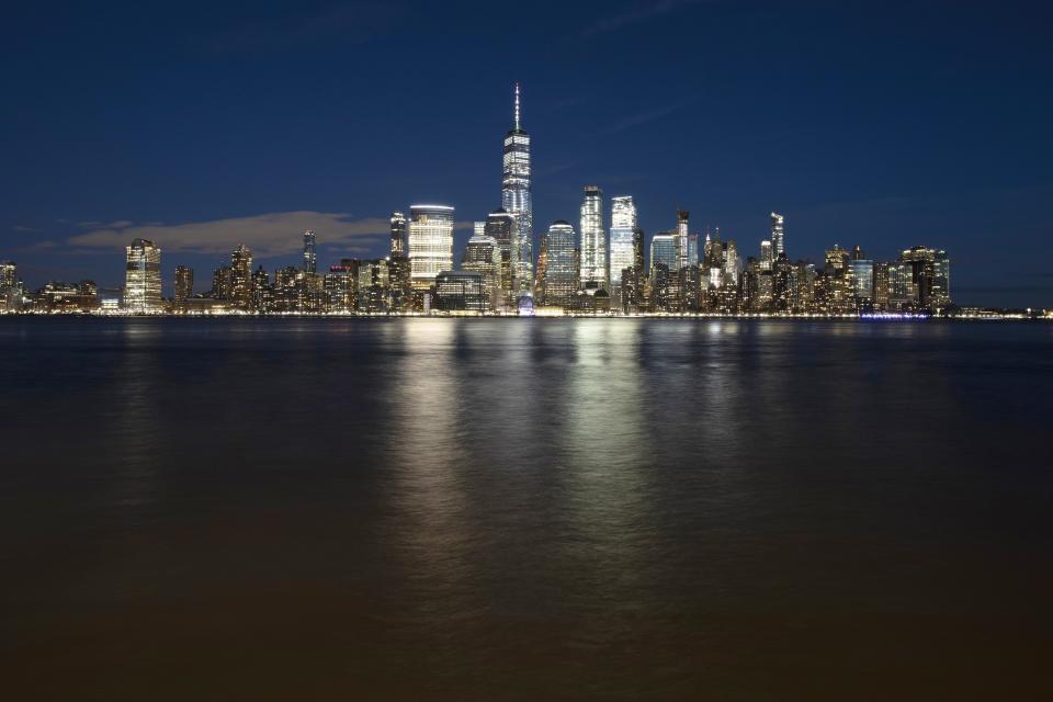 FILE - In this Dec. 28, 2018, file photo, One World Trade Center towers above the lower Manhattan skyline and the Hudson River, in New York. Big cities, like New York, aren't growing like they used to. New figures released by the U.S. Census Bureau on Thursday, May 23, 2019, show most of the nation's largest cities last year grew by a fraction of the numbers they did earlier this decade. (AP Photo/Mark Lennihan, File)