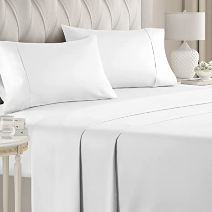 white sheets on a bed