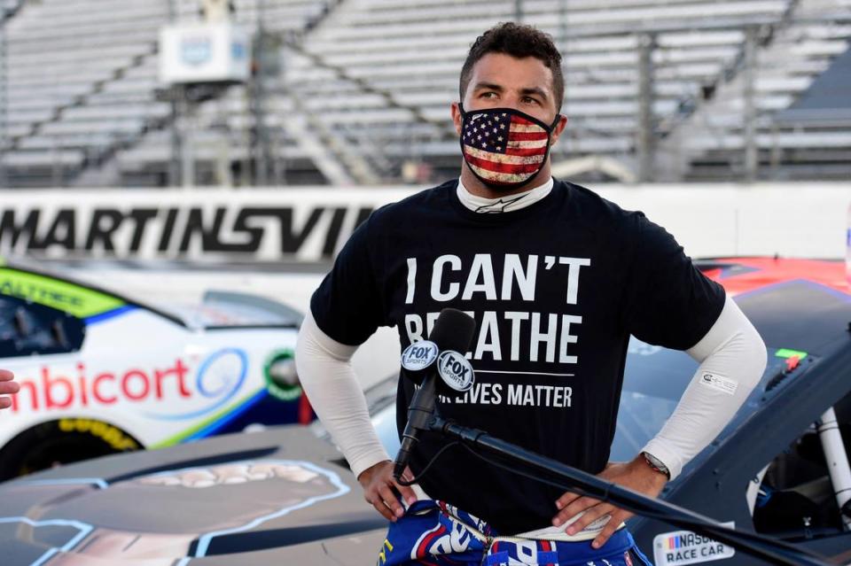 Bubba Wallace, driver of the #43 Richard Petty Motorsports Chevrolet, wears a “I Can’t Breathe - Black Lives Matter” t-shirt under his fire suit in solidarity with protesters around the world taking to the streets after the death of George Floyd on May 25, speaks to the media prior to the NASCAR Cup Series Blue-Emu Maximum Pain Relief 500 at Martinsville Speedway on June 10, 2020 in Martinsville, Virginia.