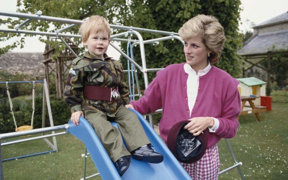 Prince Harry wearing the uniform of the Parachute Regiment of the British Army in 1986, accompanied by his mother, Diana, Princess of Wales - Tim Graham 