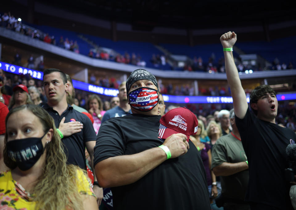 TULSA, OKLAHOMA - JUNE 20: Supporters participate in the Pledge of Allegiance during a campaign rally for U.S. President Donald Trump at the BOK Center, June 20, 2020 in Tulsa, Oklahoma. Trump is holding his first political rally since the start of the coronavirus pandemic at the BOK Center on Saturday while infection rates in the state of Oklahoma continue to rise. (Photo by Win McNamee/Getty Images)