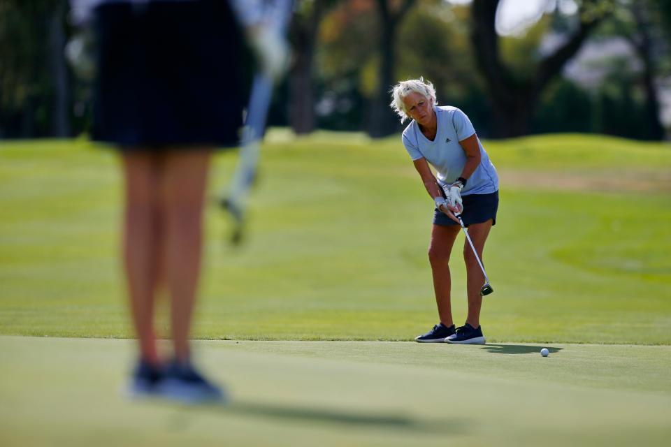 Beppie Huidekoper sinks a fantastic 50-foot putt during the 43rd Annual Country Club of New Bedford Women's Invitational Four-Ball.