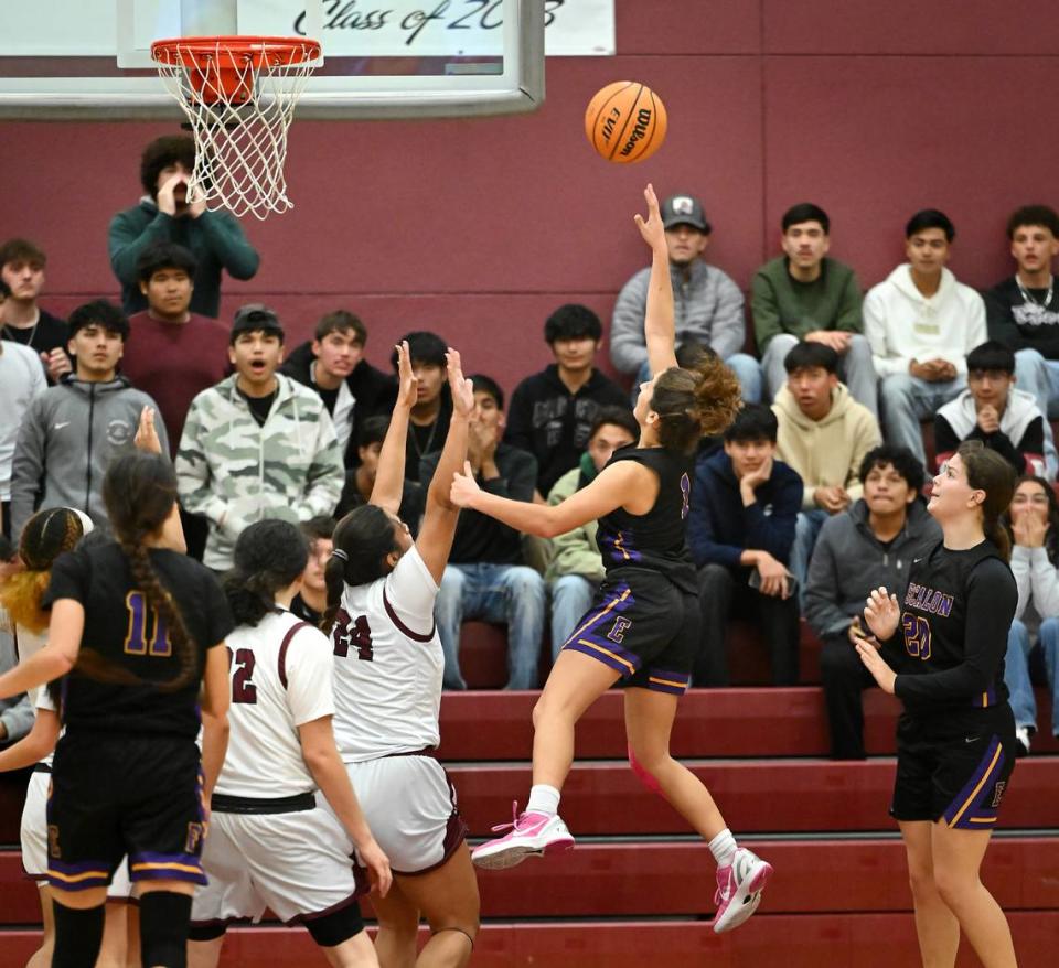 Escalon’s Sammy Lang scores the game winning basket in the Trans Valley League game with Riverbank at Riverbank High School in Riverbank, Calif., Thursday, Jan. 4, 2024. Escalon won the game 52-51. Andy Alfaro/aalfaro@modbee.com