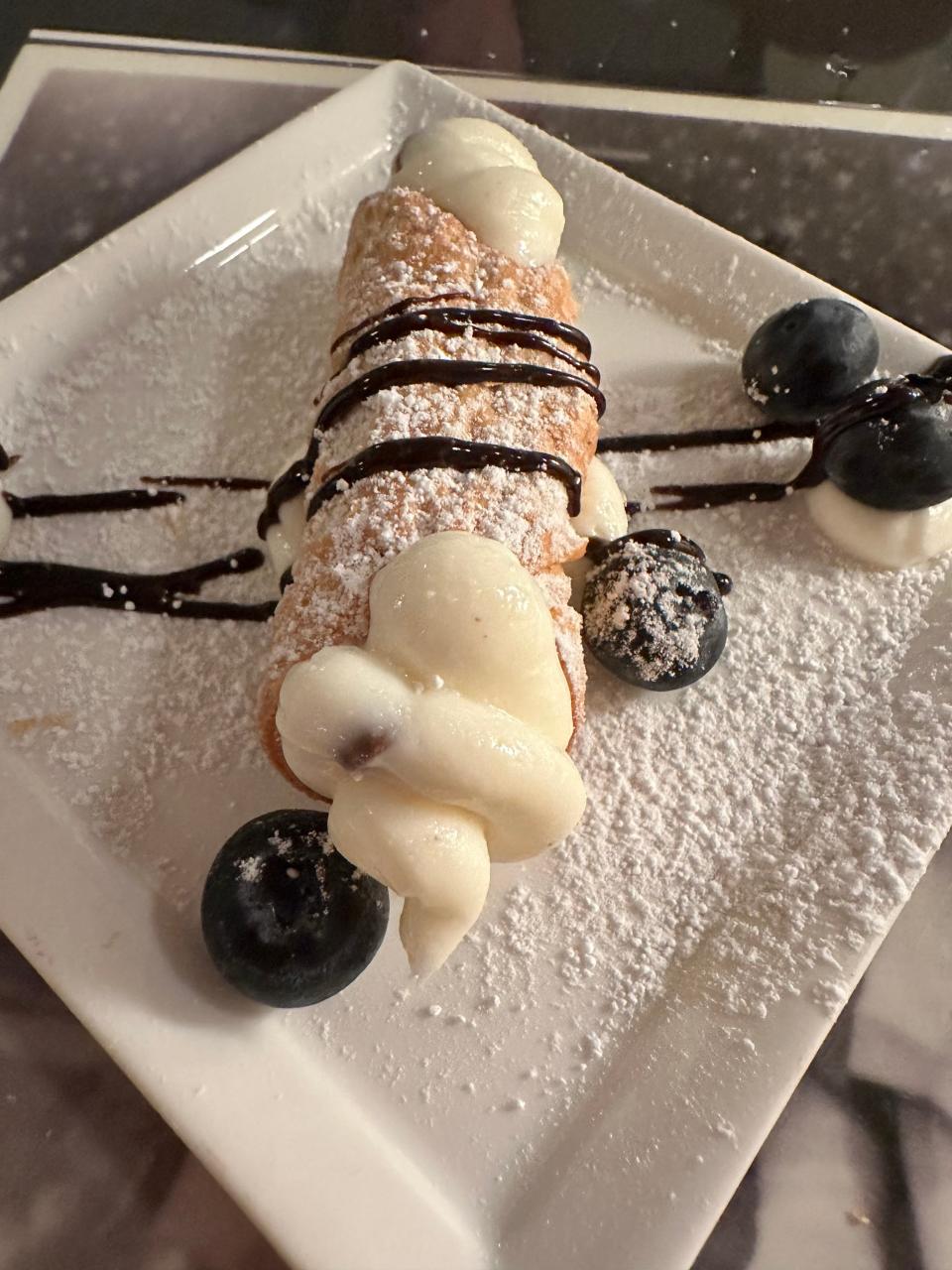 A mini cannoli finishes off the meal at Tozzi's Restaurant of Magnolia.