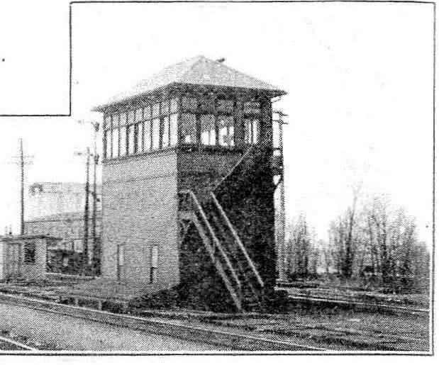 The switch tower stood across the railroad tracks from the baggage house of Union Station depot. It was torn down in 1947 when the electro-mechanical system of controling railroad switches was replaced with a fully electrical system. This photo illustrated a May 1920 article in the Railway Signal Engineer about the installatiion of the electro-mechanical system.