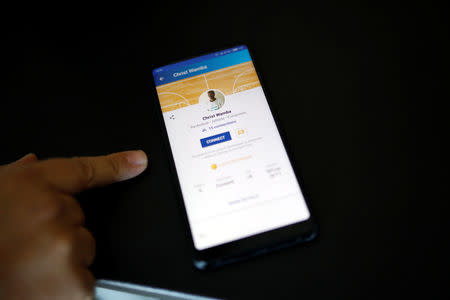 A developer of the Athlenda start-up shows the profile of Congolese basketball player Christ Wamba on the Athlenda application during an interview with Reuters in Thessaloniki, Greece, September 13, 2018. REUTERS/Alkis Konstantinidis