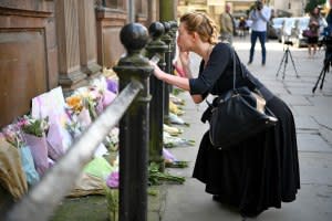 Members of the public lay flowers in St. Ann Square on May 23, 2017 in Manchester, England.