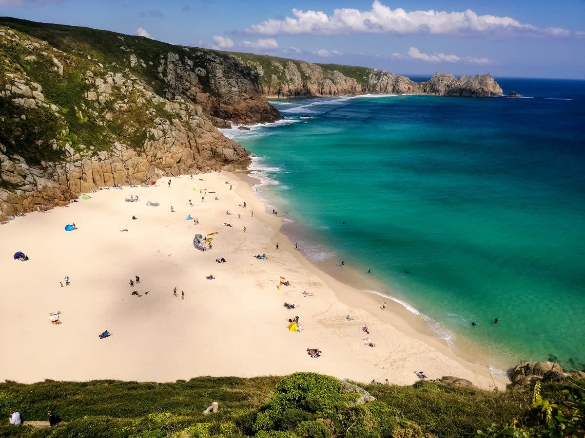Pop a parasol on Porthcurno’s white sands  (Getty Images/iStockphoto)