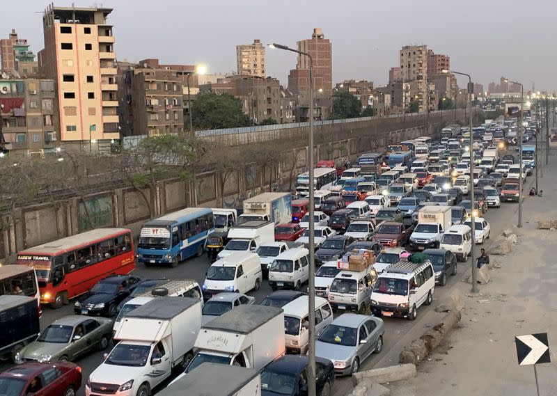 FILE PHOTO: Cars are stuck in a traffic jam before hours of curfew to contain the spread of the coronavirus disease (COVID-19), in Cairo