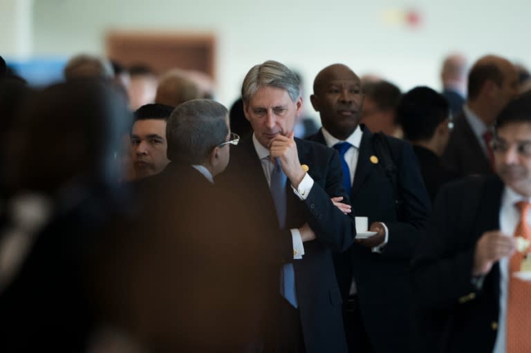 Britain's Finance Minister Philip Hammond (C) speaks with delegates at the G20 finance ministers meeting in Chengdu on July 24, 2016